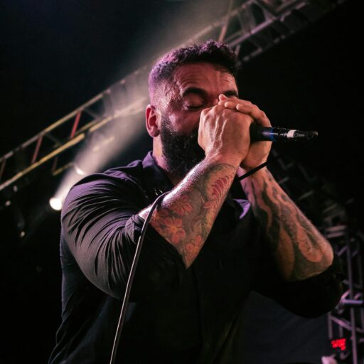 pexels-photo-4545333-4545333 Energetic singer performing live on stage with vibrant lighting in Guayaquil. Ecuador